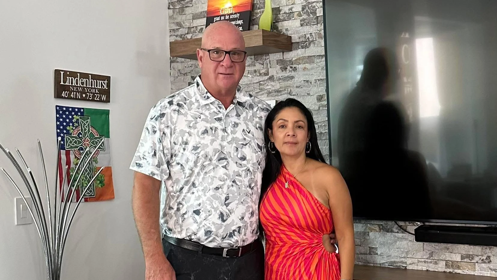 Dan Callahan and Diana standing together in their living room